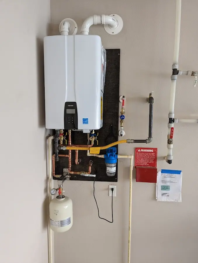 Professional plumber installing copper piping in a Mission Viejo home